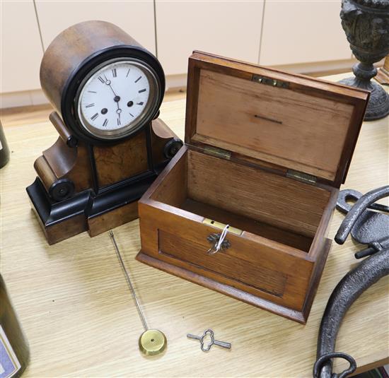 A walnut mantel clock and a late Victorian oak money box, width 24cm